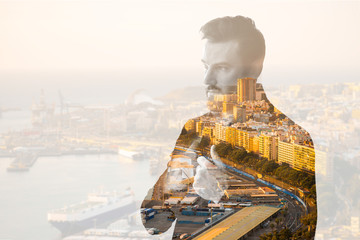 Double exposure portrait of a businessman combinated with spanish city background
