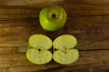 Green apple on a wooden table