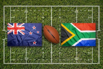 New Zealand vs. South Africa flags on rugby field