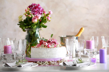 Delicious wedding cake on beautifully served table