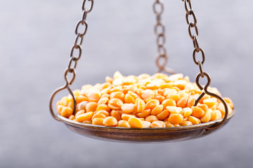 yellow dried peas in a balance scale
