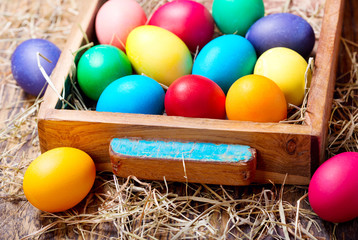 Colorful Easter eggs in a box
