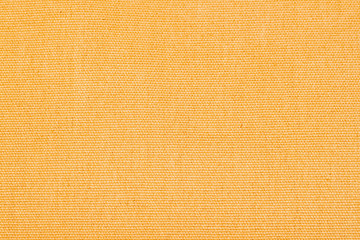 Yellow abstract fabric texture background close-up with copy space for text or image.