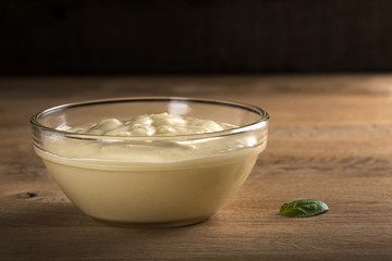 Transparent bowl filled with home made mayonnaise
