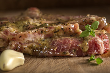 Marinated pork neck meat with spices ready for barbeque