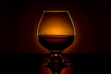 glass of brandy and a flame of fire