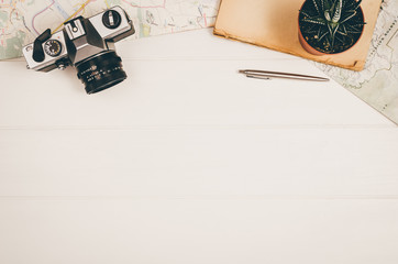 Accessories for travel top view on white wooden background with copy space. Adventure and...
