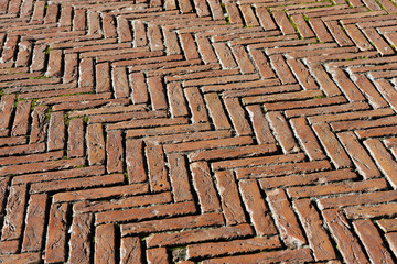 Herringbone pavement with old bricks in the Piazza del Campo. Siena, Tuscany, Italy
