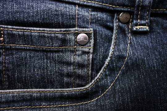 Abstract dark blue jeans background