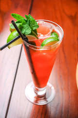 Alcoholic cocktail on the bar, close-up in glass