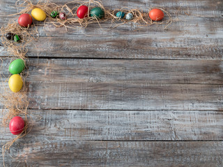 Easter Composition with chicken eggs on the warm wooden wackgrou