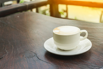 Close up white cup of Coffee, latte on the wooden table