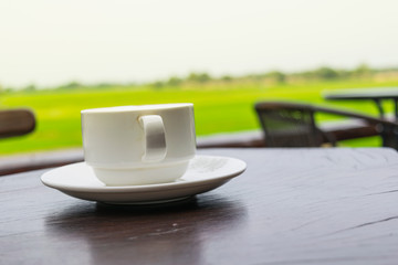 Close up white cup of Coffee, latte on the wooden table