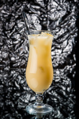 Alcoholic cocktail on the bar, close-up in glass