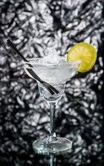 Alcoholic cocktail on the bar, close-up in glass