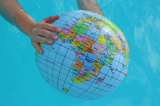 ball for swimming " globe " in water in hand 4