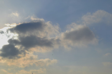 The sun hid behind white clouds