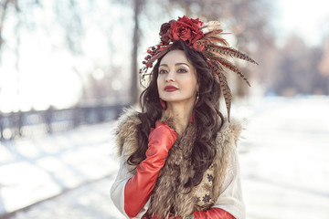 The girl in furs and red clothes. winter