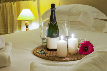 bottle of champagne in bed