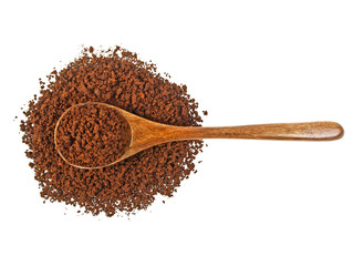 Instant coffee grains in wooden spoon on a white background