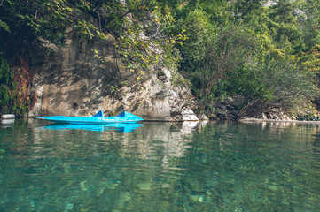 Fototapeta na wymiar Single kayak in the canyon