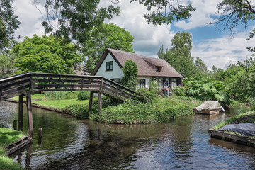 Fototapeta premium Giethoorn in The Netherlands with its typical thatched cottages and ditches