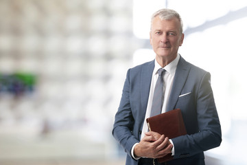 Senior businessman standing at office