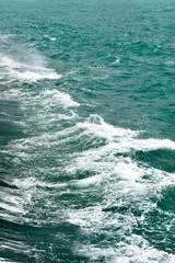 the texture of the sea waves closeup of turquoise