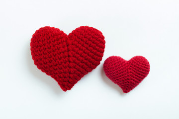 Crochet hearts on white background. Valentine's Day. Symbol of love.
