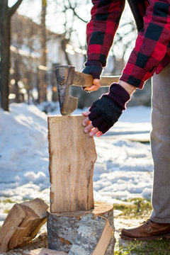 Man chopping firewood in the yard