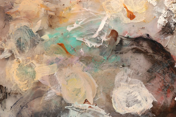Original acrylic colors on palette. Abstract art background. Fragment of artwork. Brushstrokes of paint. Colorful texture.