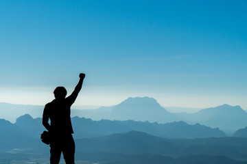 Traveler Man right hand raised,Mountains landscape on background