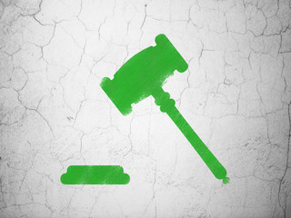 Law concept: Gavel on wall background