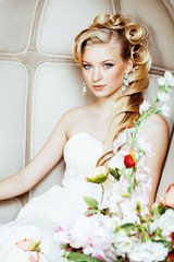 beauty young bride alone in luxury vintage interior with a lot of flowers close up