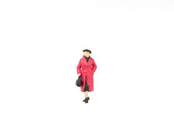 Fototapeta na wymiar Miniature people business traveler on background with space for text