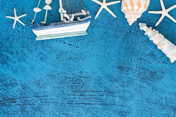 Top view Decorative sailing boats and marine items on wooden background