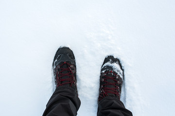 Man in winter boots standing in snow