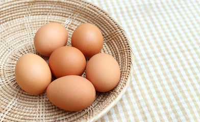 Close up Eggs Chicken on wooden basket 2
