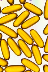 Pills or capsules on white background