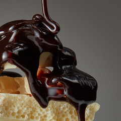 syrop pouring onto a piece of chocolate