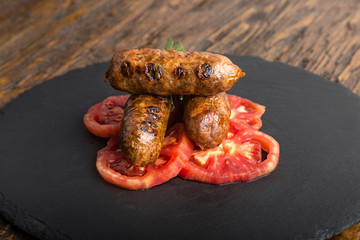 grilled sausages with tomato