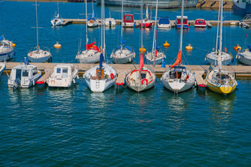 Many yachts parked at the pier