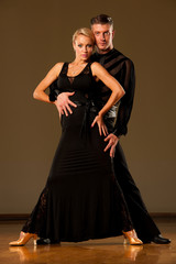 Beautiful ballroom  couple preforms their exhibition dance