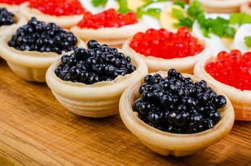 Tartlets with caviar and onion.