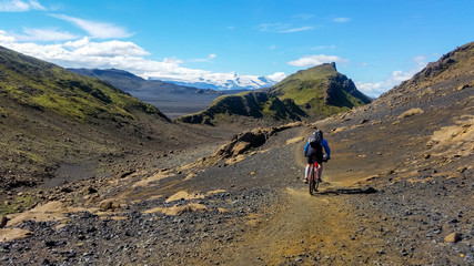 mountain biker cruising through iceland, Europe