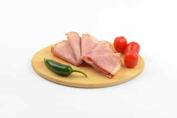 ham with cherry tomatoes and chili pepper
