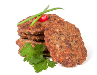 liver pancakes or cutlets with parsley and green onions isolated on white background