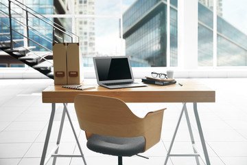 Modern office interior and cityscape view through window