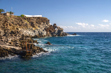 Fototapeta na wymiar Stormy sea beating on the rocks. Tenerife island, Spain