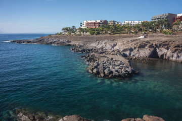 Obraz premium View of the blue Bay and the colored houses on the rock. Tenerife island, Spain